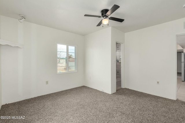 unfurnished bedroom featuring light colored carpet and ceiling fan