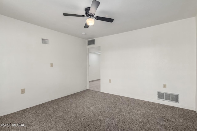 spare room with light colored carpet and ceiling fan