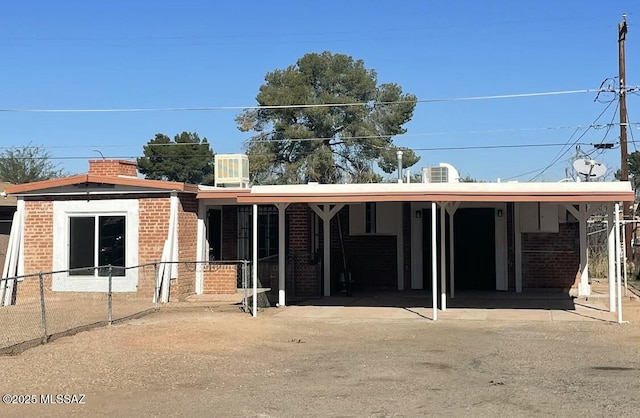 exterior space with a carport