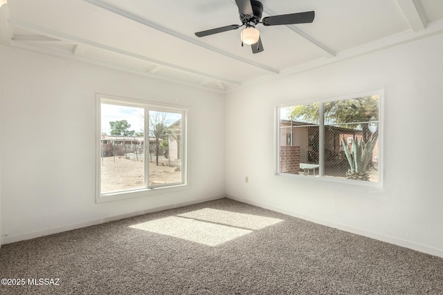 carpeted empty room with beam ceiling and plenty of natural light