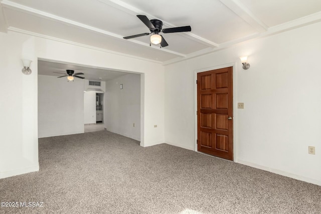 carpeted empty room with ceiling fan and beam ceiling