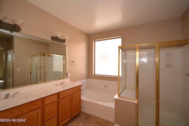 bathroom with plus walk in shower, tile patterned flooring, and vanity