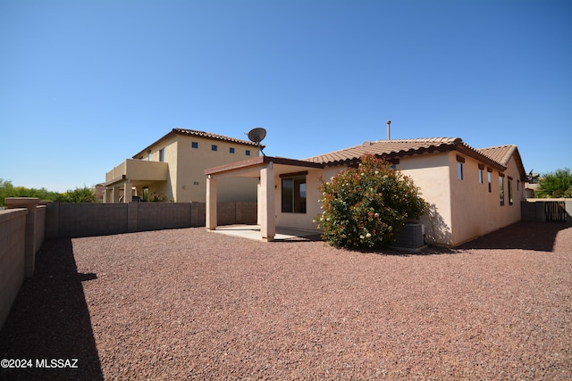 back of property with a patio area