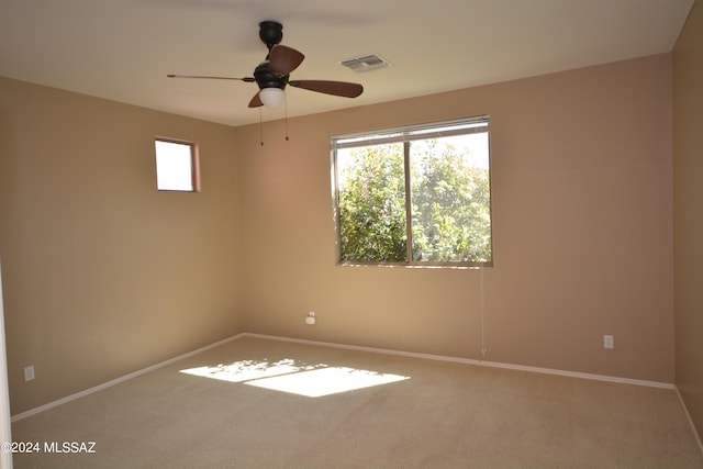 empty room with carpet and ceiling fan