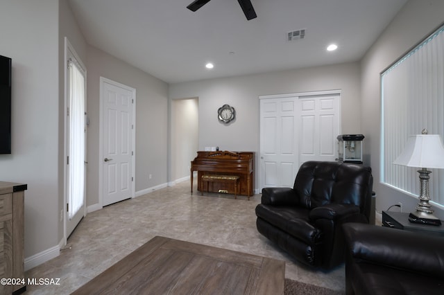 sitting room featuring ceiling fan