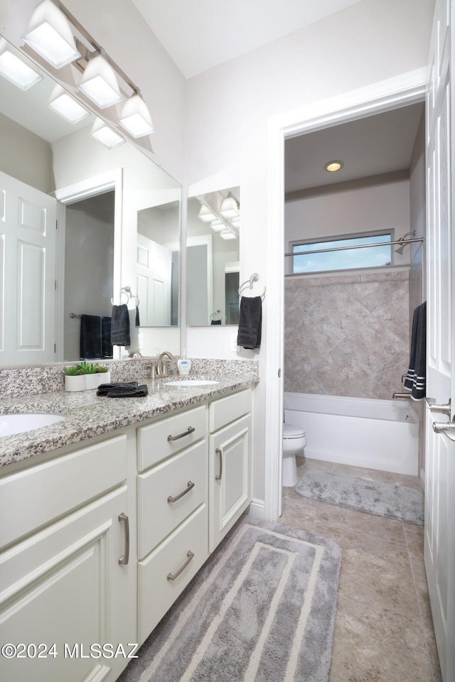 full bath featuring double vanity, shower / washtub combination, toilet, and a sink