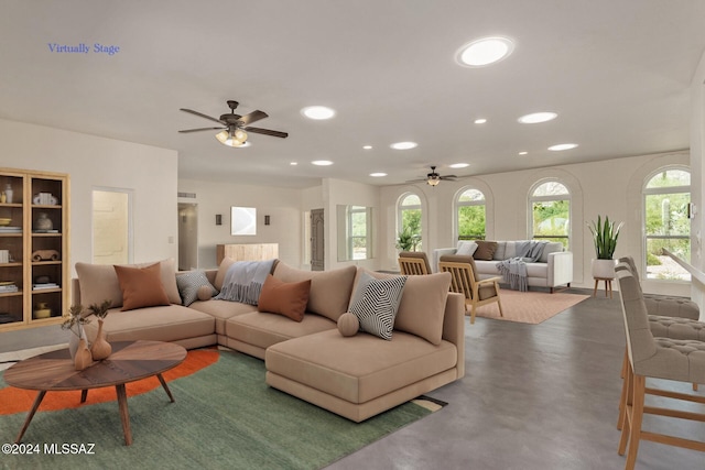 living room featuring ceiling fan, concrete flooring, and recessed lighting