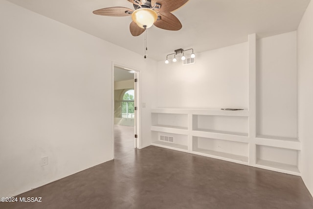 unfurnished room with finished concrete flooring, ceiling fan, and visible vents