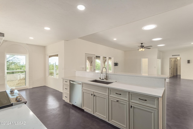 kitchen featuring sink, ceiling fan, dishwasher, and gray cabinetry