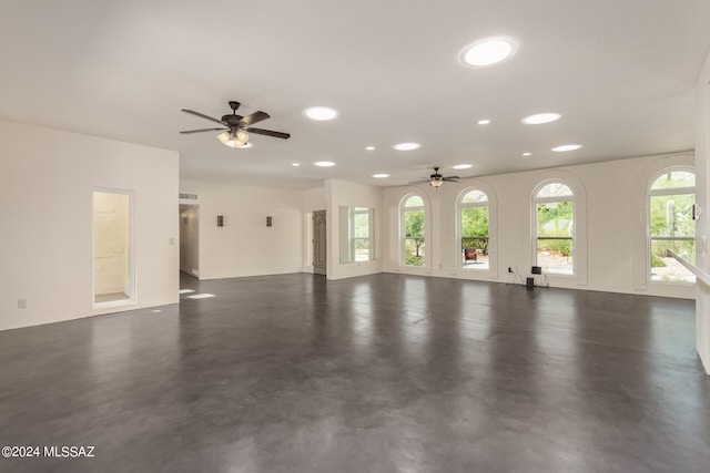 unfurnished living room featuring ceiling fan, concrete floors, visible vents, and recessed lighting