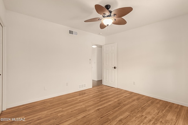 unfurnished room with ceiling fan and light hardwood / wood-style flooring