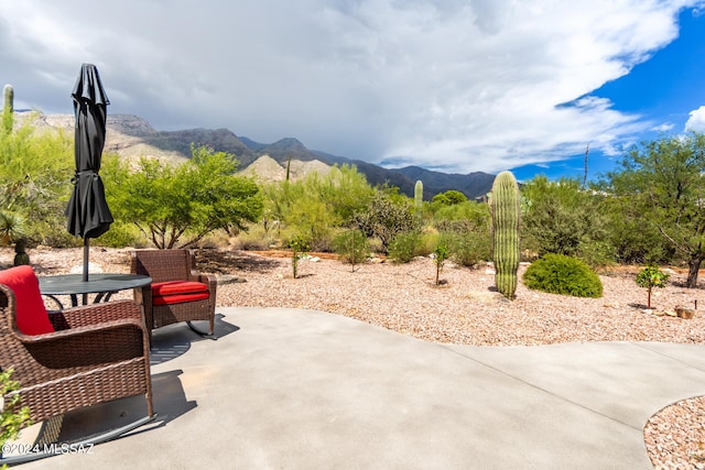 view of patio / terrace with a mountain view