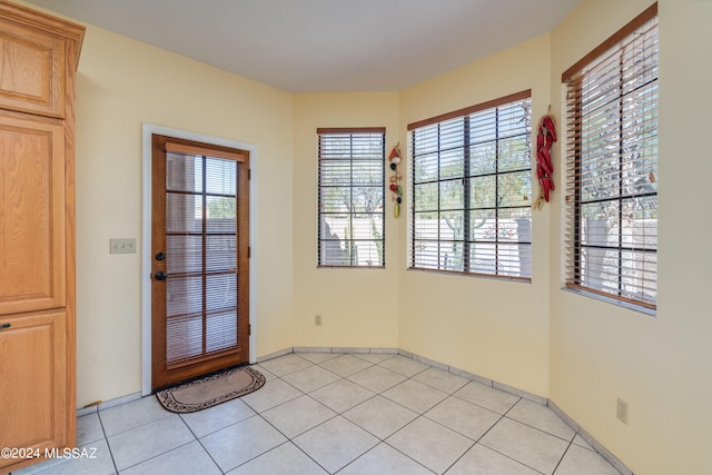 entryway featuring light tile patterned floors