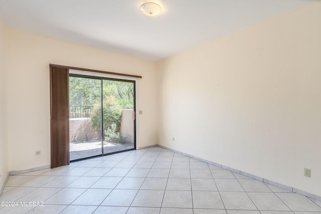 empty room featuring light tile patterned floors