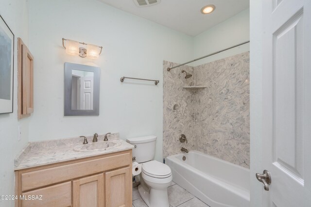 full bathroom featuring vanity, toilet, tile patterned floors, and tiled shower / bath