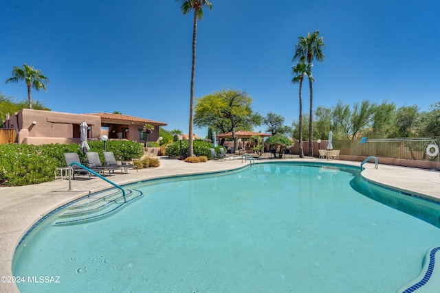 view of swimming pool with a patio