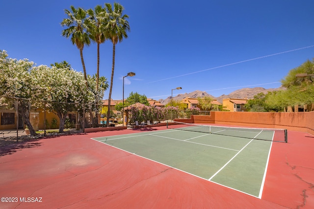 view of sport court with basketball court and a mountain view