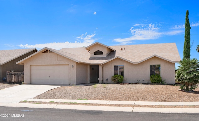 ranch-style home with a garage