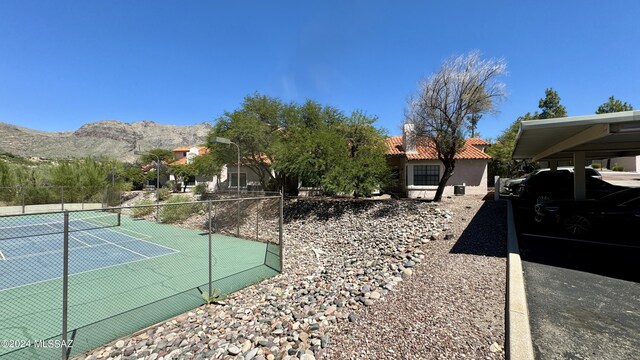 view of sport court with a mountain view