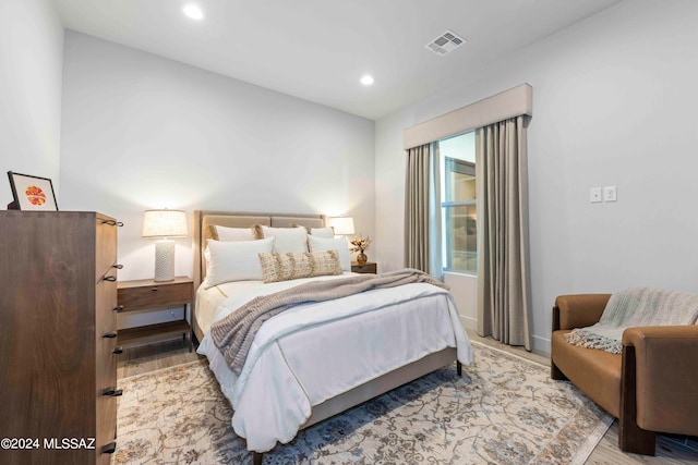 bedroom with light hardwood / wood-style floors