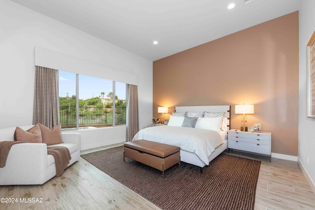 bedroom with hardwood / wood-style flooring