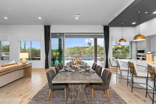 dining room with light hardwood / wood-style floors