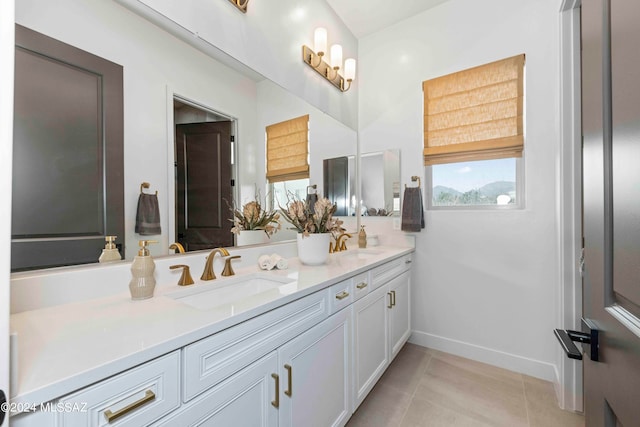 bathroom with vanity and tile patterned floors