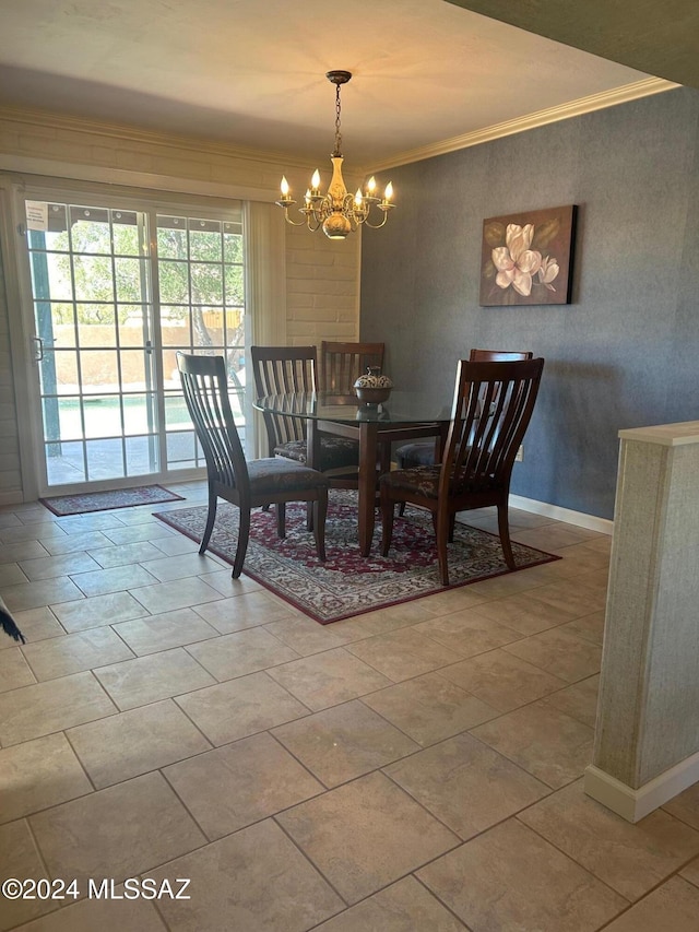 dining room with a chandelier and crown molding