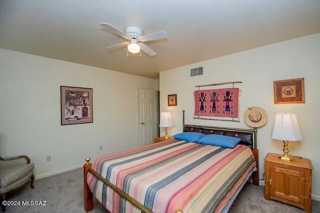 bedroom with ceiling fan and carpet floors