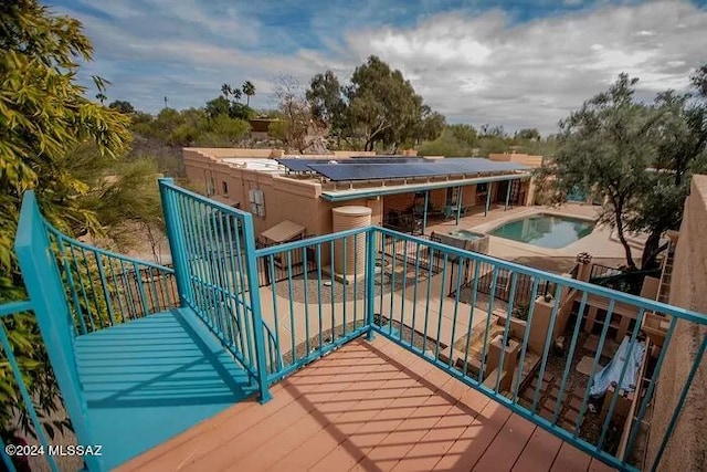 view of patio / terrace with ceiling fan, a fenced in pool, and a mountain view