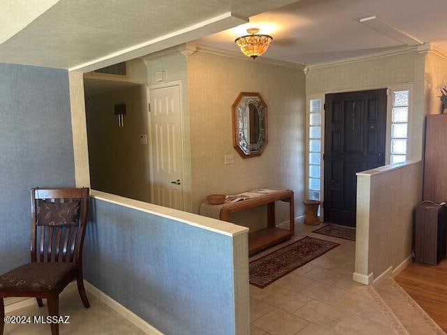 entrance foyer featuring radiator and crown molding