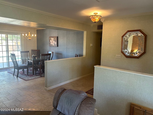 dining room with tile patterned floors, crown molding, and an inviting chandelier