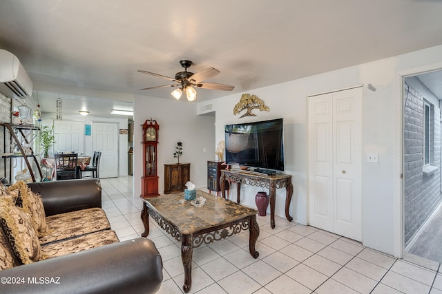 living room with ceiling fan, light tile patterned floors, and a wall mounted air conditioner