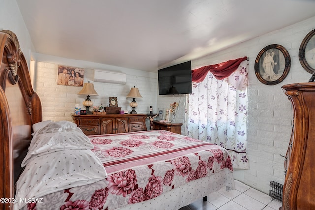 tiled bedroom featuring brick wall and a wall mounted AC