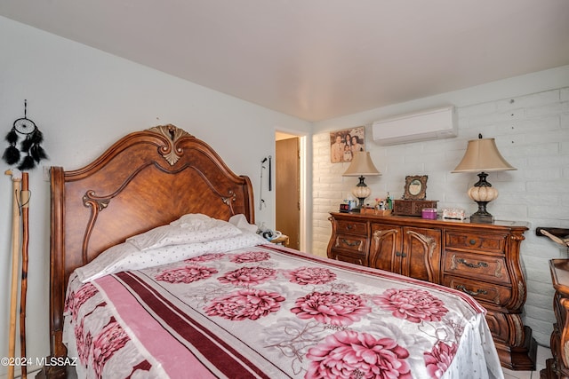 bedroom with brick wall and a wall mounted AC