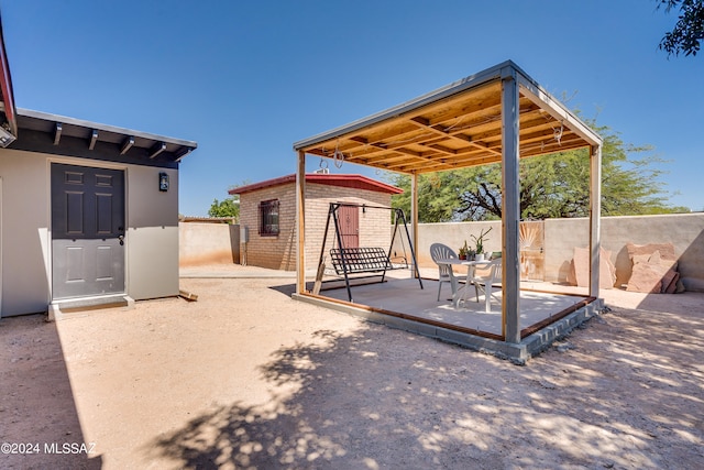 view of patio featuring a storage shed