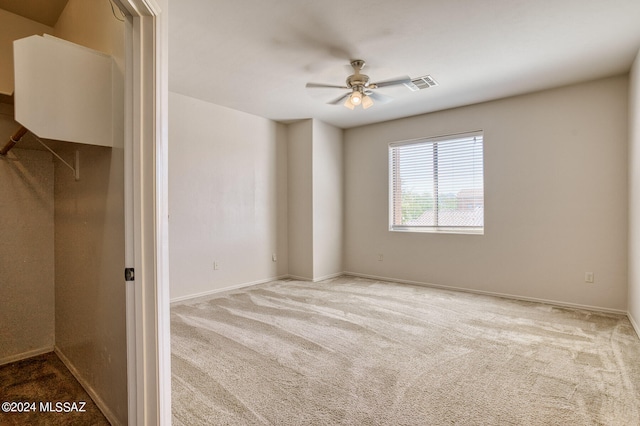 unfurnished bedroom featuring carpet flooring and ceiling fan