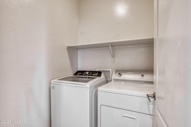 washroom featuring independent washer and dryer