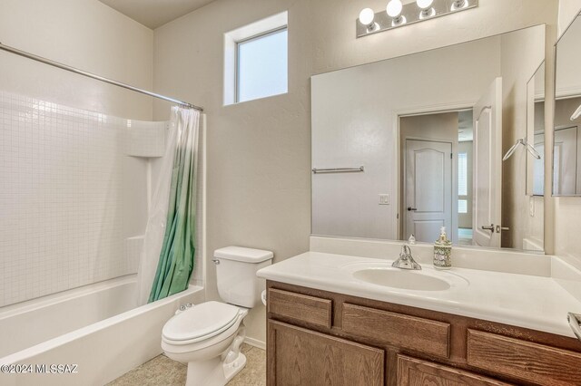 full bathroom featuring tile patterned floors, vanity, toilet, and shower / bathtub combination with curtain