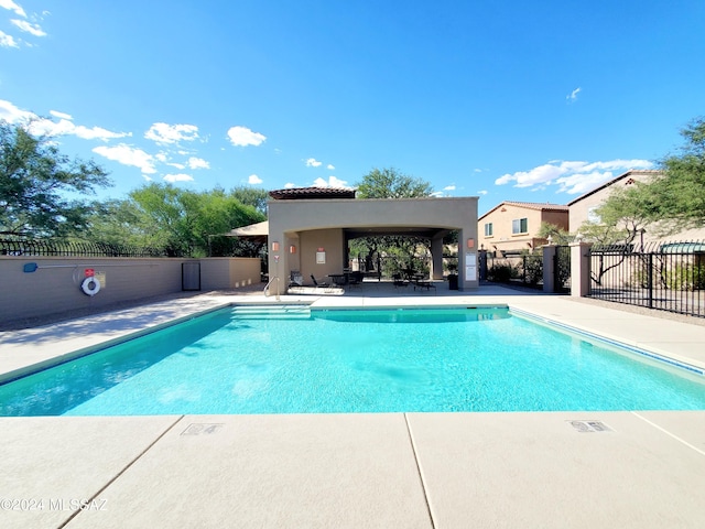 view of swimming pool with a patio area