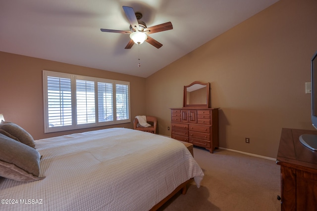 bedroom featuring ceiling fan, light carpet, and vaulted ceiling