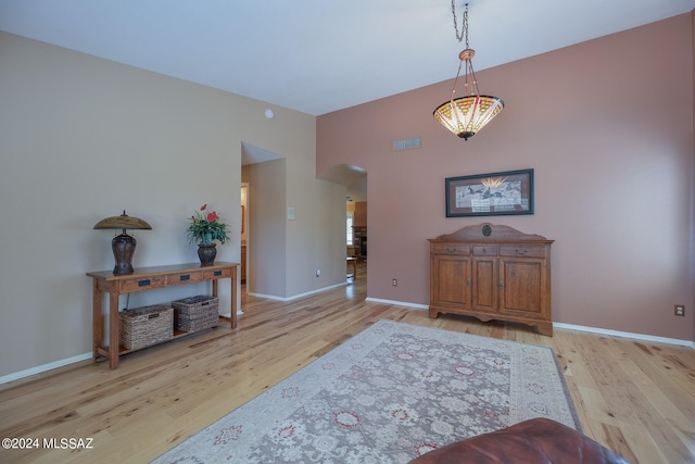 interior space with a chandelier and light hardwood / wood-style floors