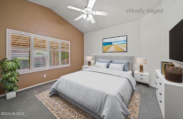 carpeted bedroom with vaulted ceiling and ceiling fan