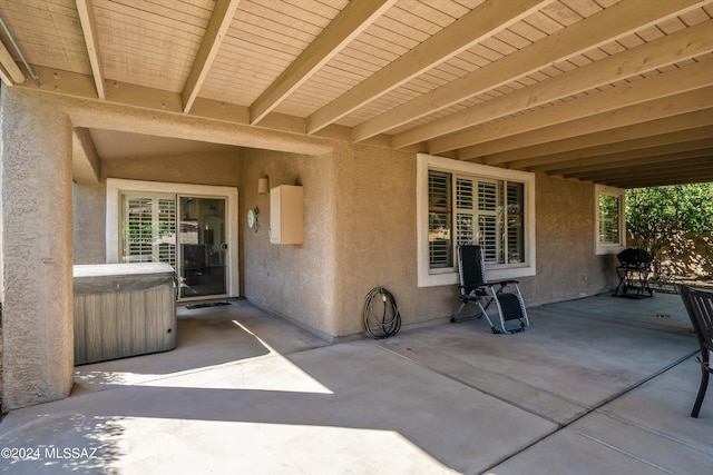 view of patio featuring a hot tub