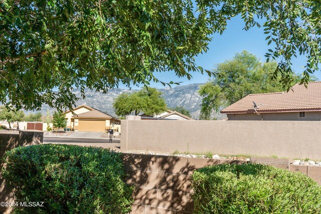 exterior space with a mountain view and a garage