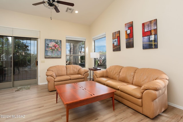 living room with ceiling fan, plenty of natural light, and light hardwood / wood-style floors