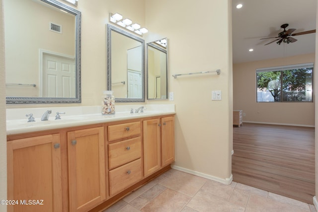 bathroom featuring tile patterned flooring, vanity, and ceiling fan