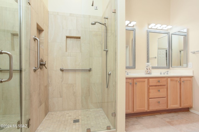 bathroom featuring vanity and an enclosed shower