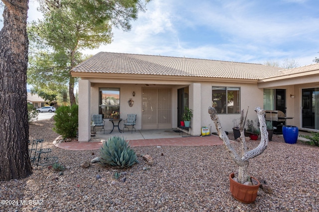 rear view of house featuring a patio