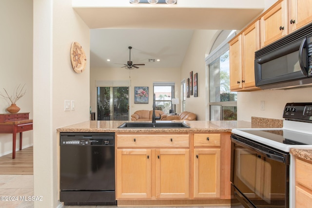 kitchen with kitchen peninsula, light brown cabinetry, ceiling fan, sink, and black appliances